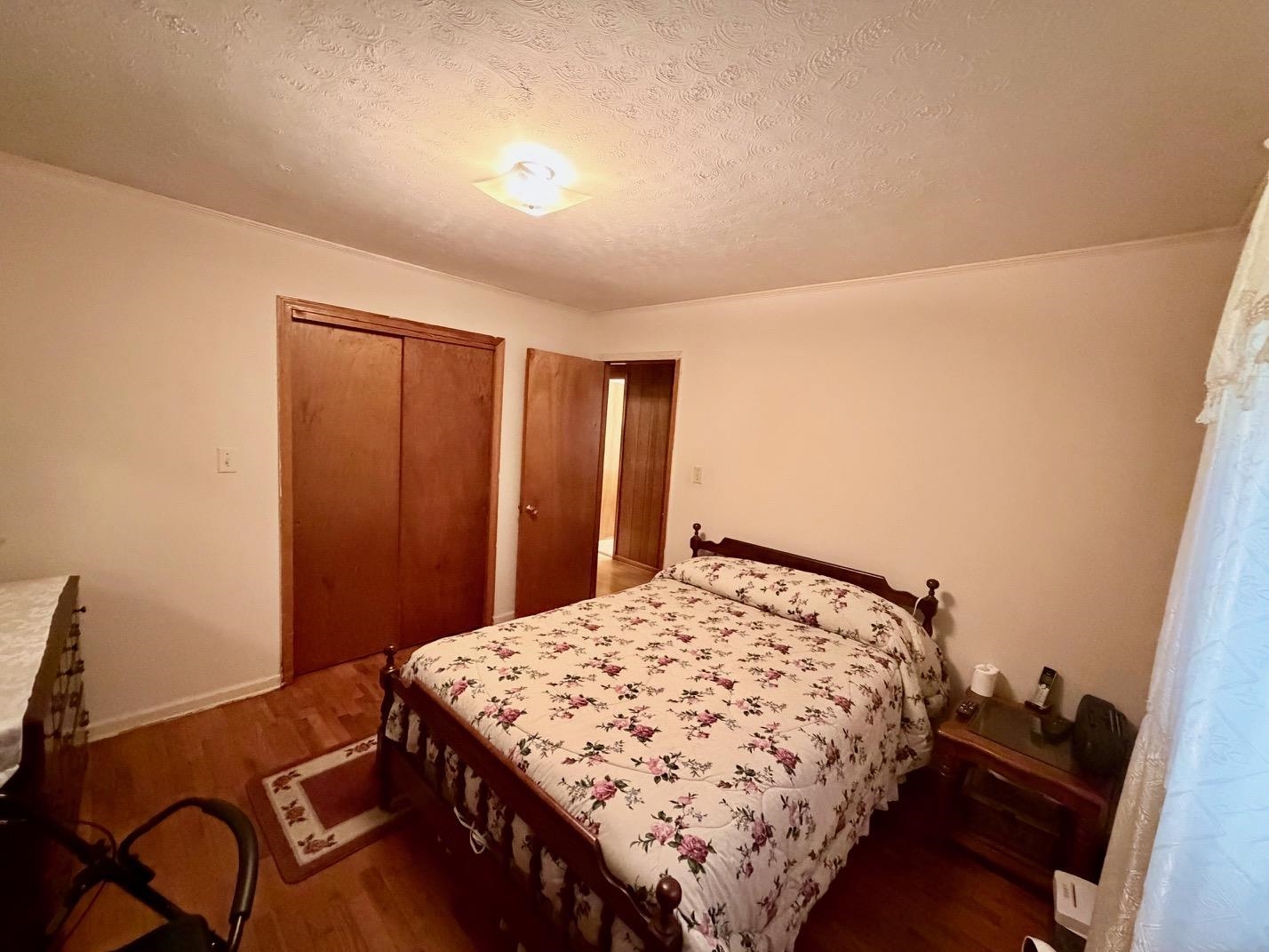 321 Pipkin Road Jackson, TN 38305 - Photo 11 of 16 a bedroom with a bed and dresser