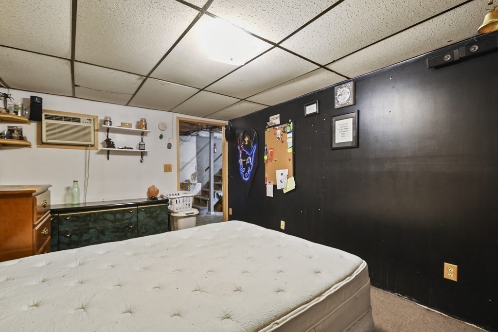 279 Little Alum Road Brimfield, MA 01010 - Photo 20 of 37 a bedroom with a bed and wooden floor