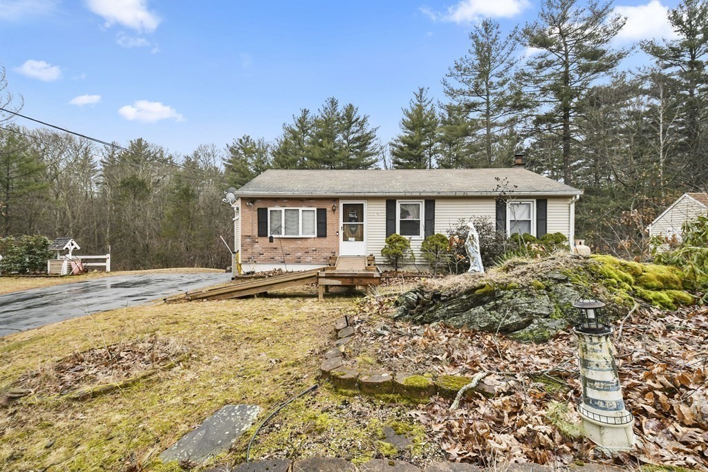 279 Little Alum Road Brimfield, MA 01010 - Photo 2 of 37 a house with trees in front of it