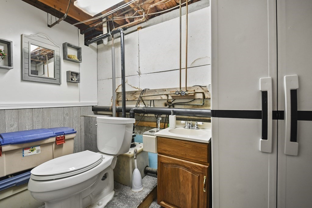 279 Little Alum Road Brimfield, MA 01010 - Photo 22 of 37 a white toilet sitting next to a bathroom sink