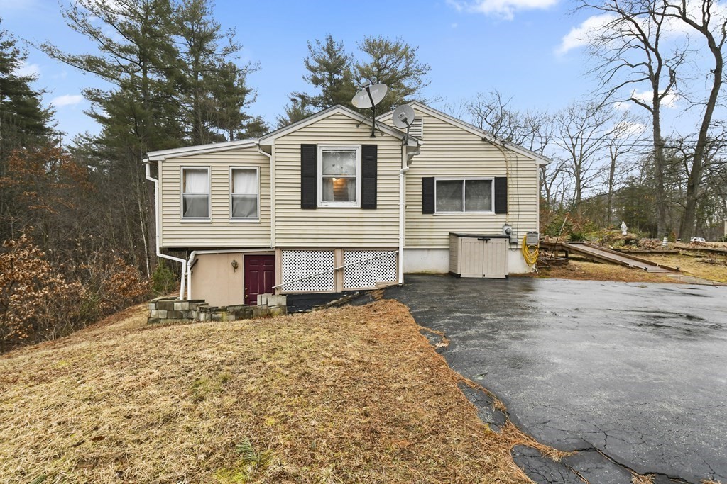 279 Little Alum Road Brimfield, MA 01010 - Photo 28 of 37 a front view of a house with a yard