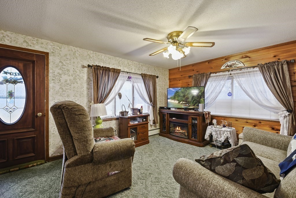 279 Little Alum Road Brimfield, MA 01010 - Photo 3 of 37 a living room with furniture a rug and a window