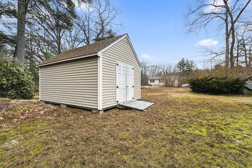 279 Little Alum Road Brimfield, MA 01010 - Photo 31 of 37 a view of a house with a yard and garage