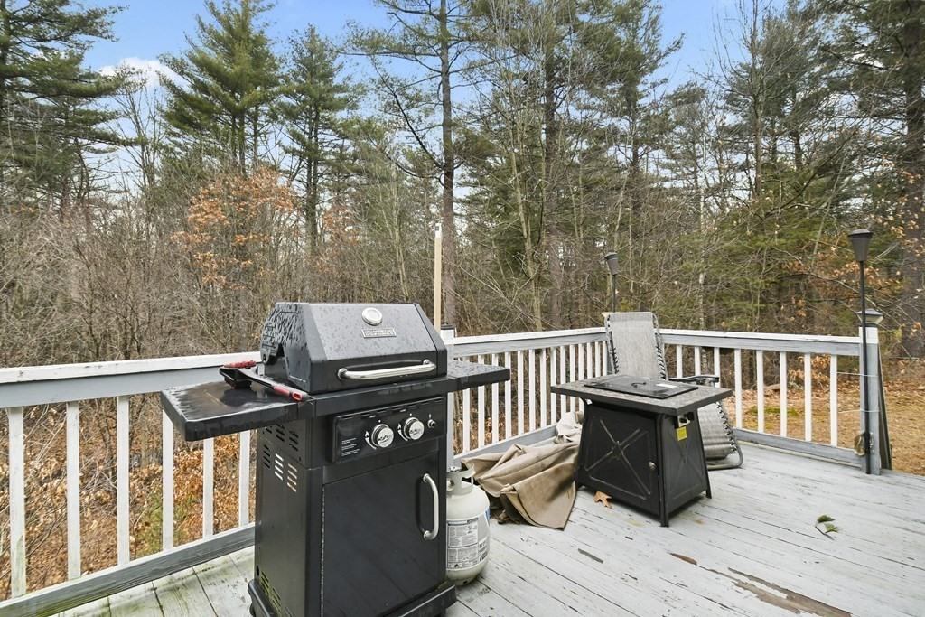 279 Little Alum Road Brimfield, MA 01010 - Photo 33 of 37 a view of a deck with two chairs and wooden fence