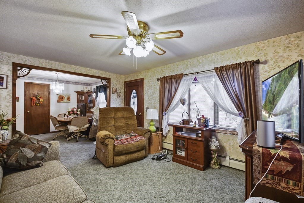 279 Little Alum Road Brimfield, MA 01010 - Photo 5 of 37 a living room with furniture and a large window
