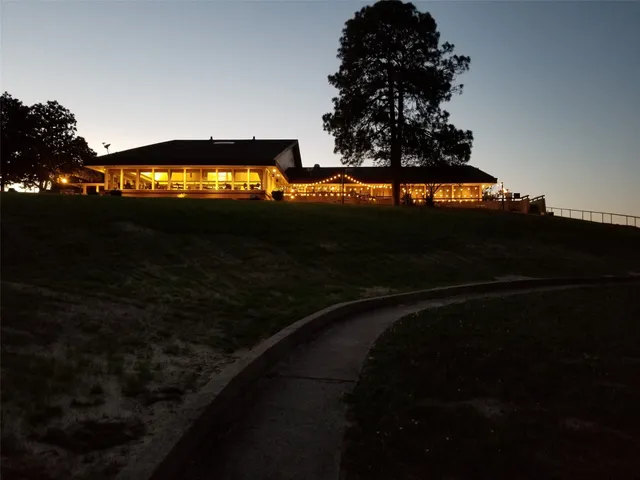 an aerial view of a house with outdoor space