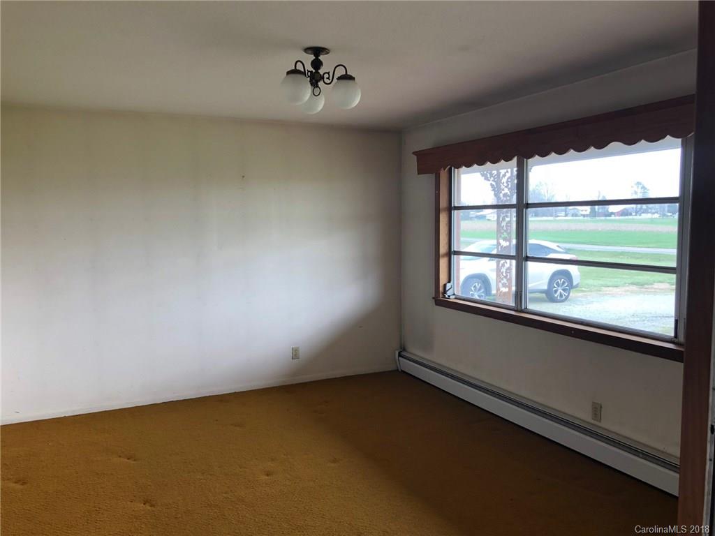 320 Weaver Road Salisbury, NC 28147 - Photo 3 of 10 an empty room with a window