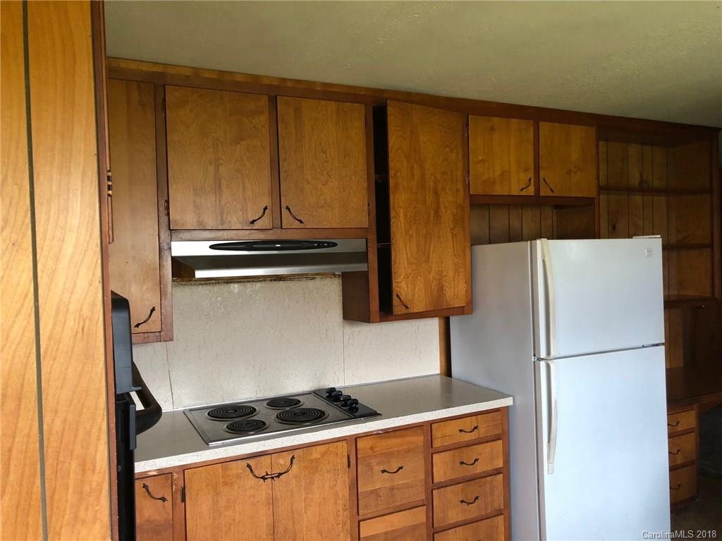 320 Weaver Road Salisbury, NC 28147 - Photo 6 of 10 a kitchen with stainless steel appliances granite countertop a refrigerator and a stove top oven