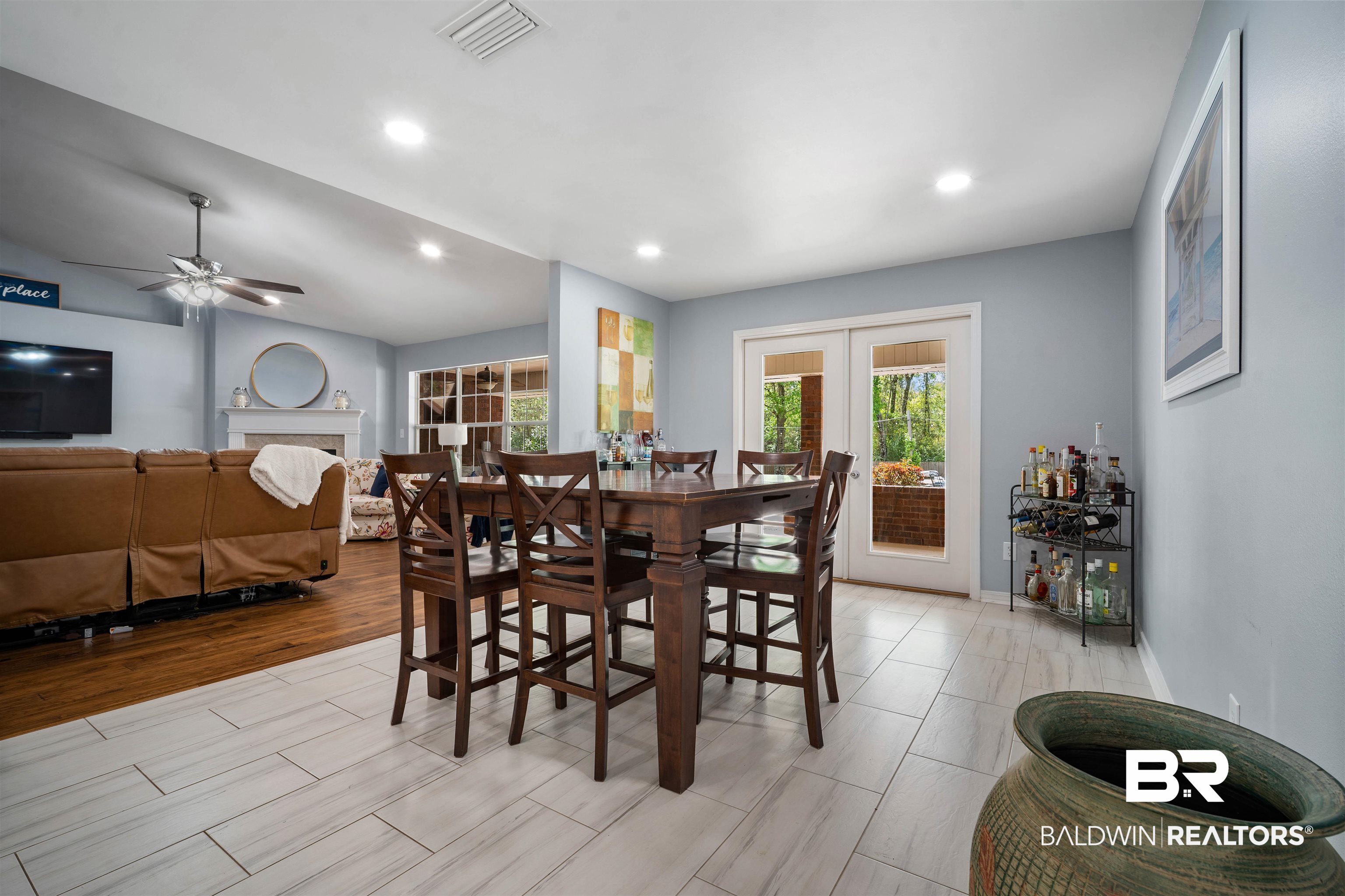10713 Rigby Drive Mobile, AL 36695 - Photo 10 of 35 Dining room featuring a ceiling fan, recessed lighting, french doors, a fireplace, and wood finish floors