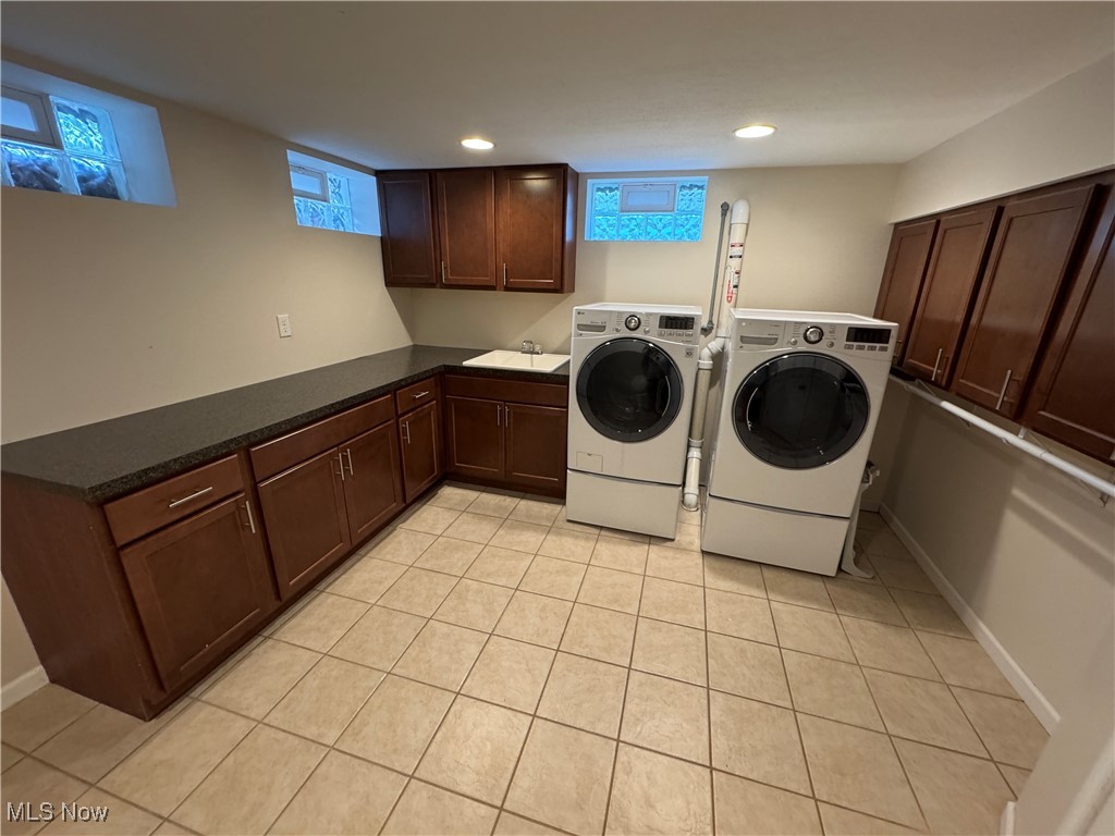 941 Middlebury Road Kent, OH 44240 - Photo 14 of 23 Clothes washing area featuring washer and clothes dryer, light tile patterned flooring, a sink, and recessed lighting