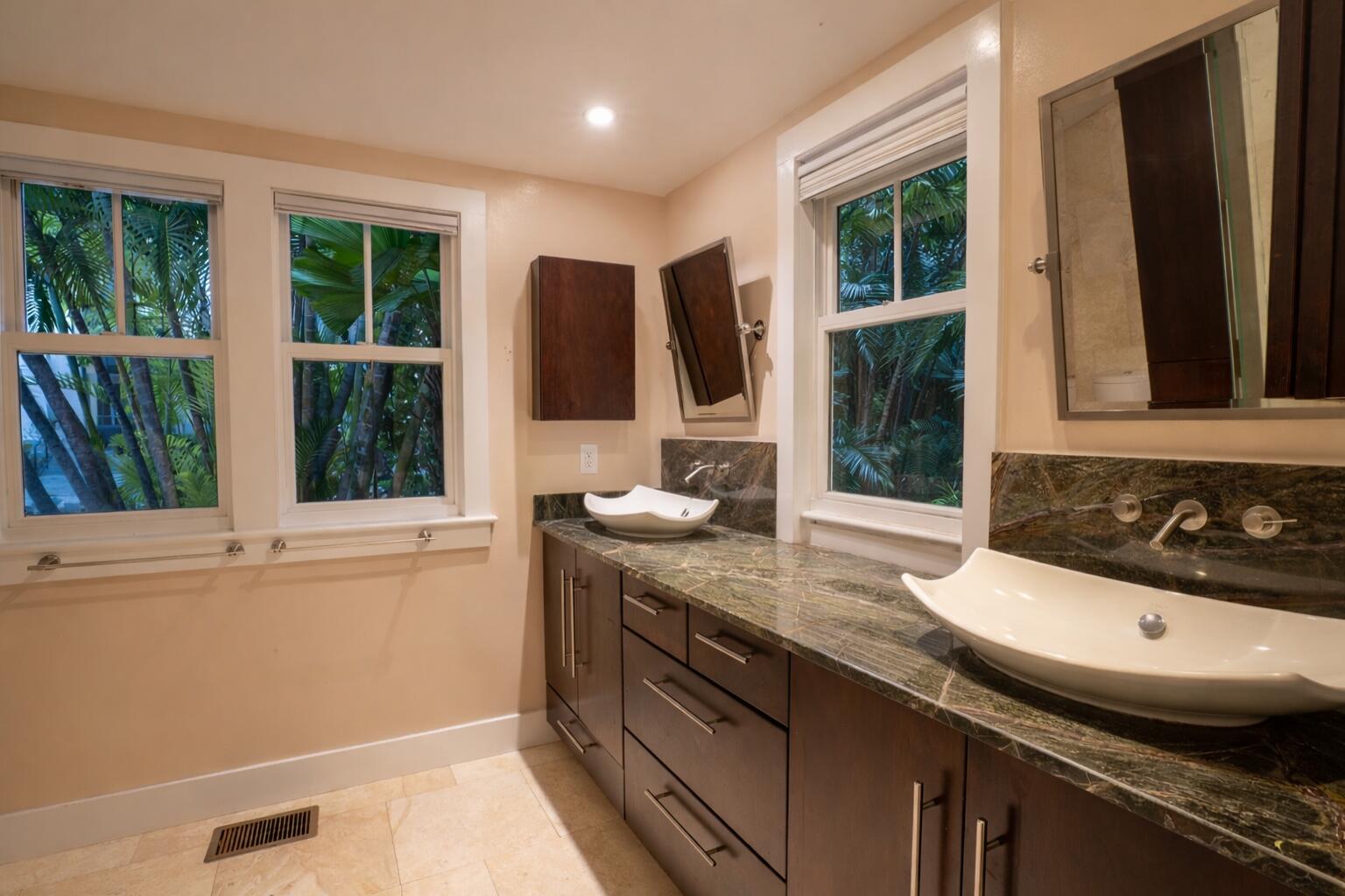 1120 Seminary Street Key West, FL 33040 - Photo 17 of 42 a bathroom with a granite countertop sink and a large mirror