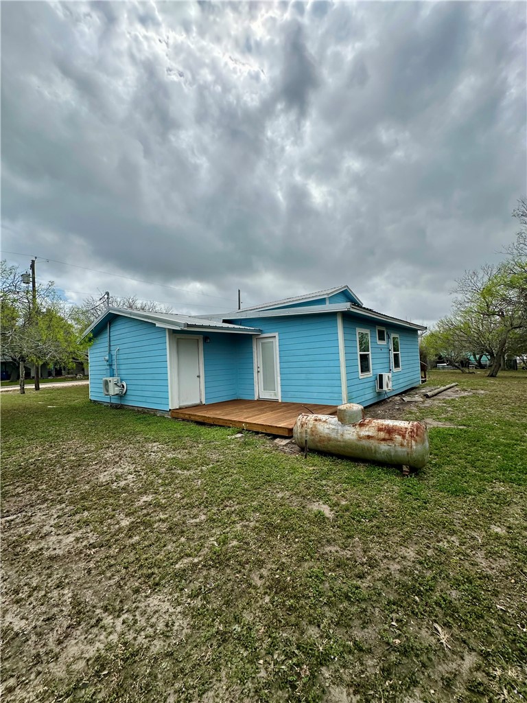 323 Copano Bayside, TX 78340 - Photo 18 of 22 a backyard of a house with lots of green space