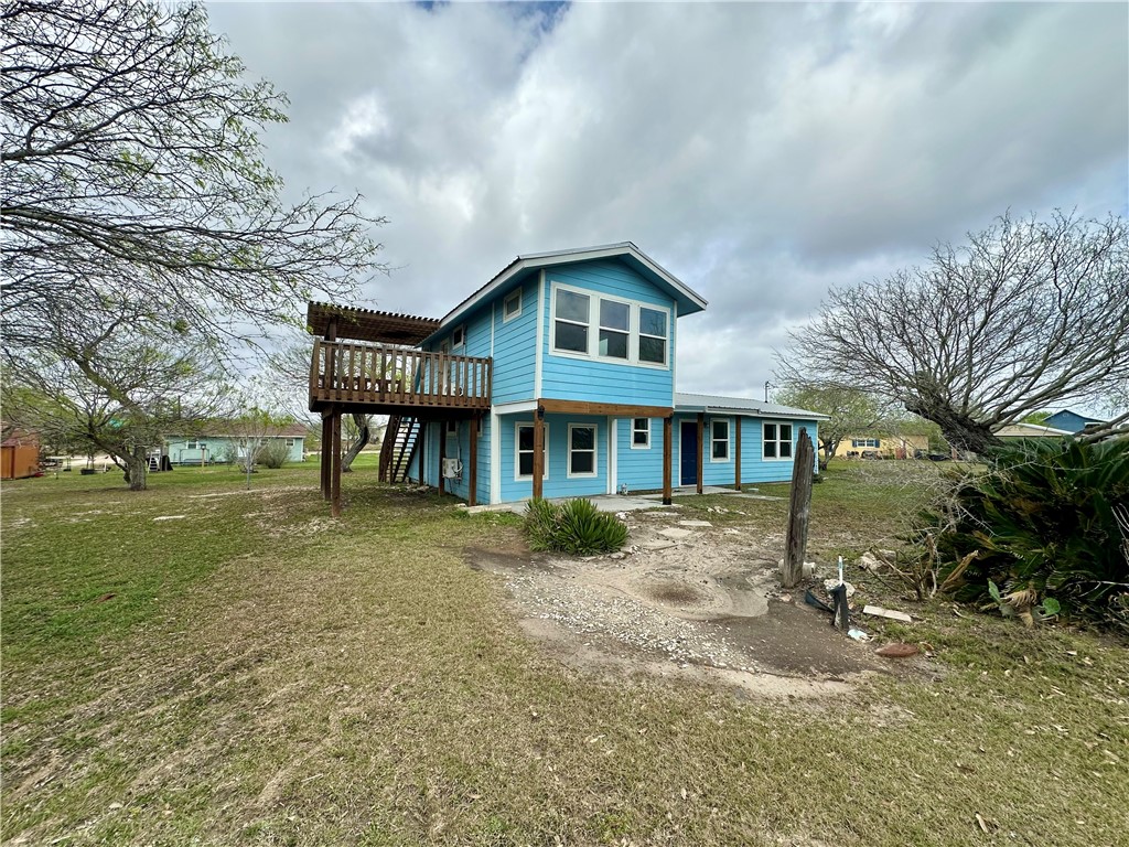 323 Copano Bayside, TX 78340 - Photo 2 of 22 a front view of a house with garden