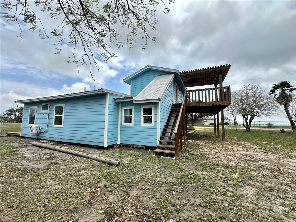 323 Copano Bayside, TX 78340 - Photo 21 of 22 a view of a house with a yard