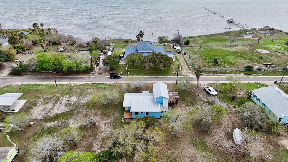 323 Copano Bayside, TX 78340 - Photo 5 of 22 an aerial view of a house with a garden and lake view