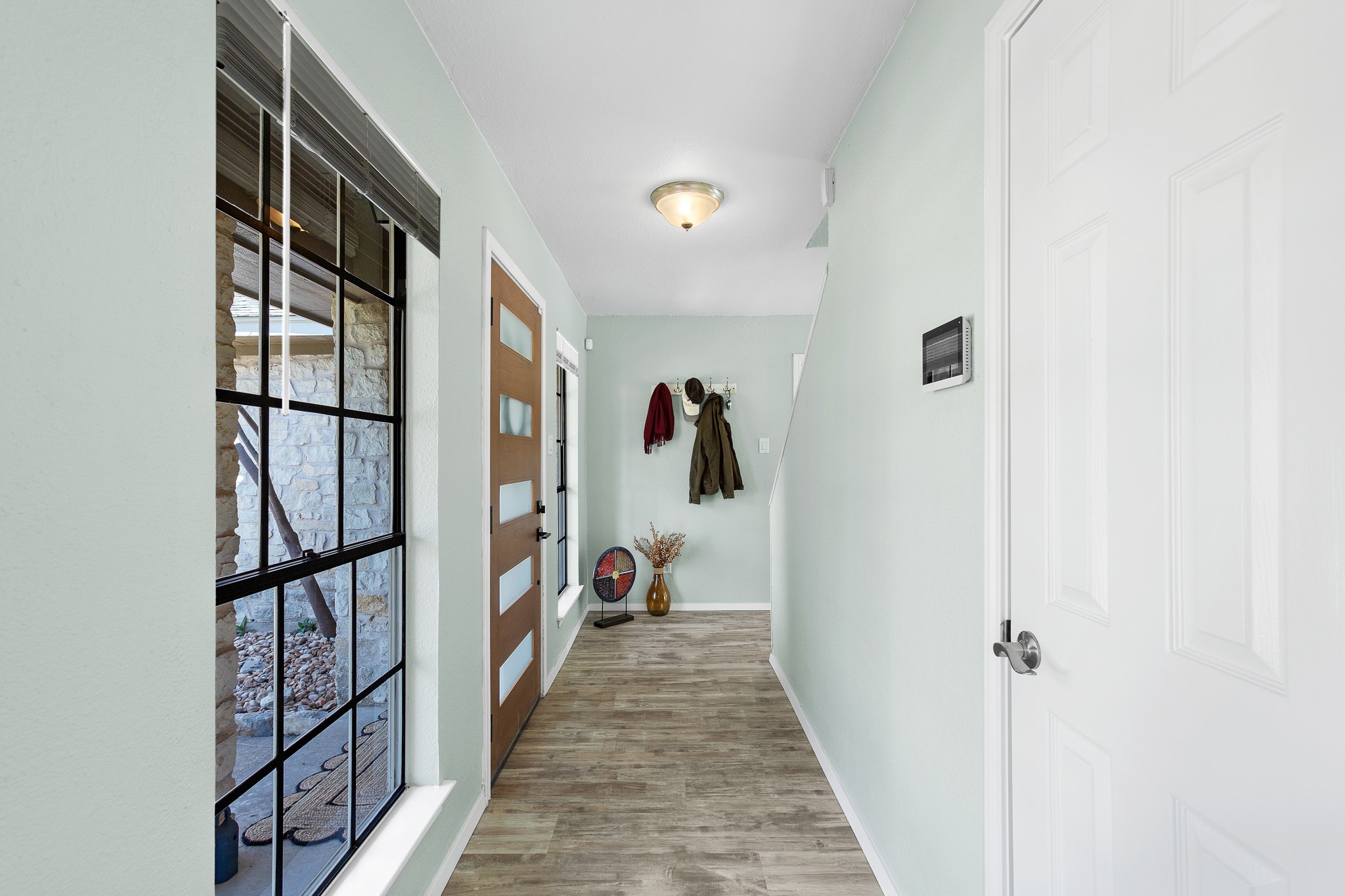 8007 Swindon Lane Austin, TX 78745 - Photo 12 of 27 Hall with baseboards and light wood-type flooring