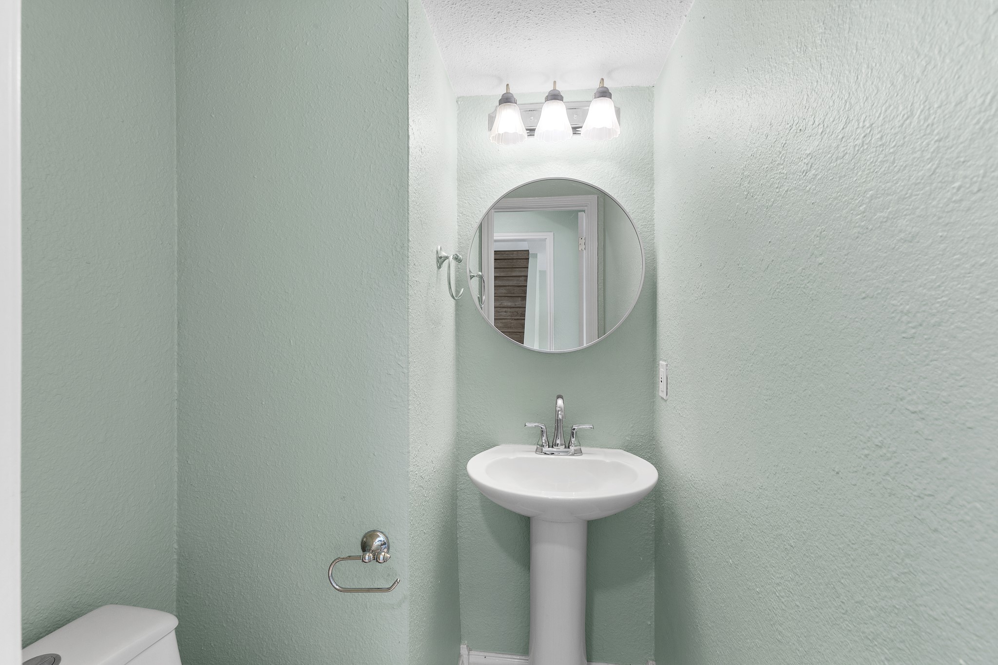 8007 Swindon Lane Austin, TX 78745 - Photo 16 of 27 Half bathroom downstairs