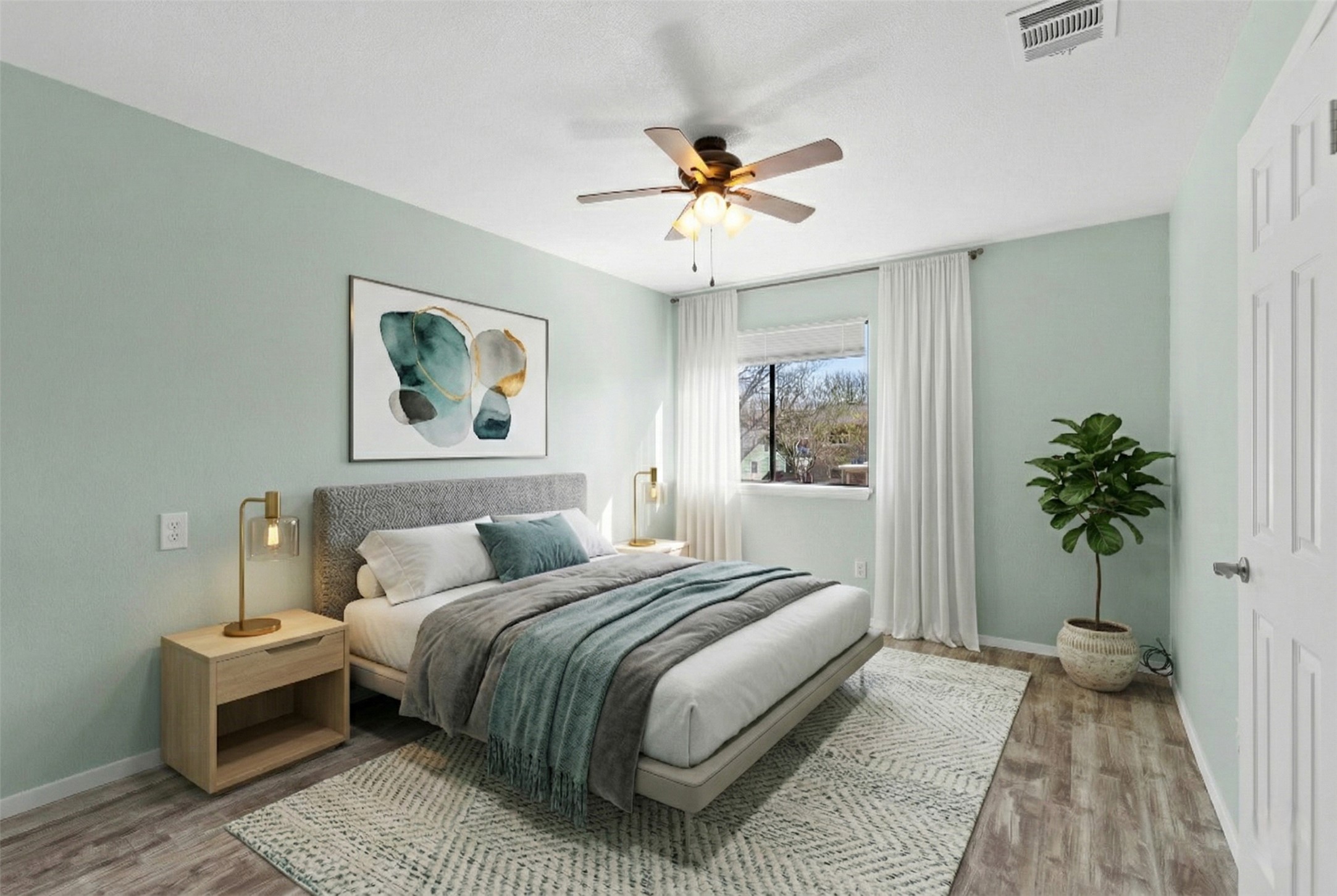 8007 Swindon Lane Austin, TX 78745 - Photo 19 of 27 Bedroom featuring light wood finished floors and a ceiling fan