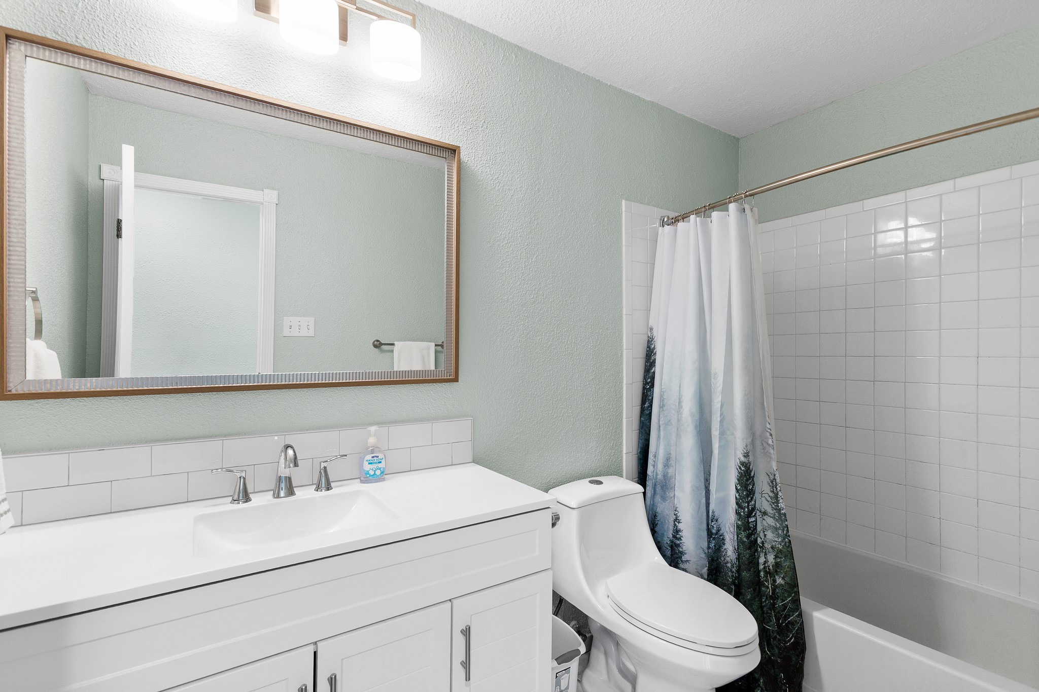 8007 Swindon Lane Austin, TX 78745 - Photo 22 of 27 Bathroom featuring a new vanity, and shower / tub combo
