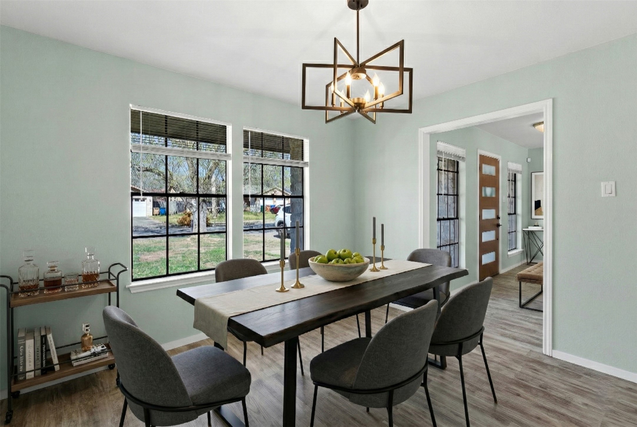 8007 Swindon Lane Austin, TX 78745 - Photo 10 of 27 Dining area featuring wood finished floors and a chandelier