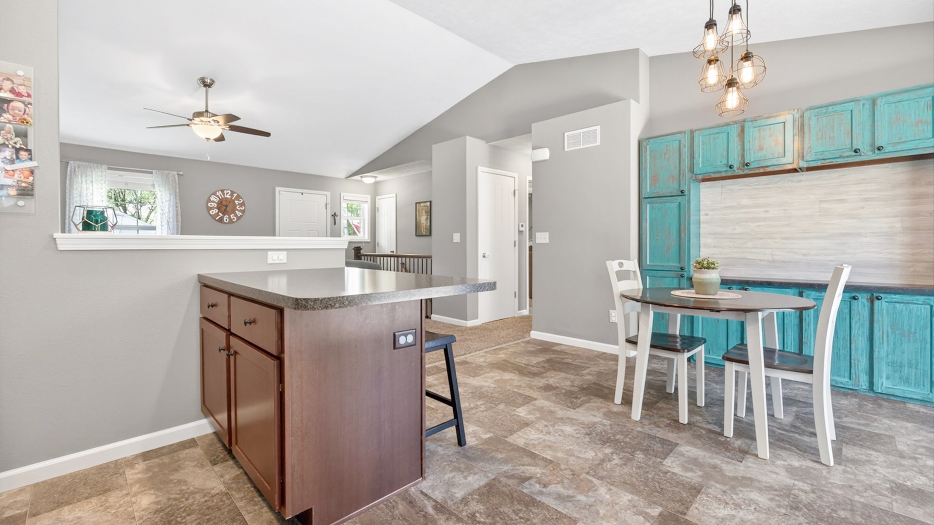 308 East Locust Street Normal, IL 61761 - Photo 6 of 40 a kitchen with kitchen island granite countertop a table chairs sink and cabinets
