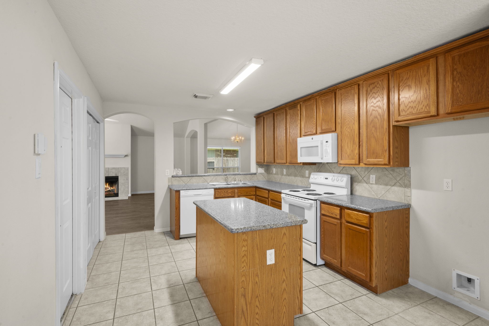 3226 Woodwind Road Montgomery, TX 77356 - Photo 15 of 34 a kitchen with a cabinets and counter space