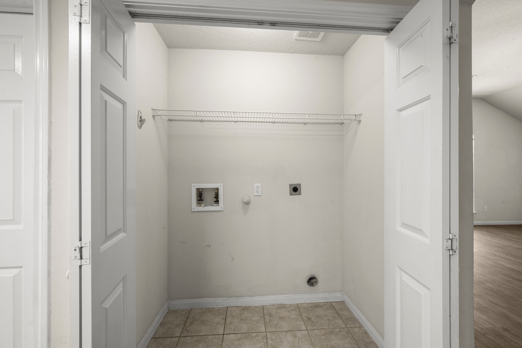 3226 Woodwind Road Montgomery, TX 77356 - Photo 18 of 34 a view of a room with racks on the wall