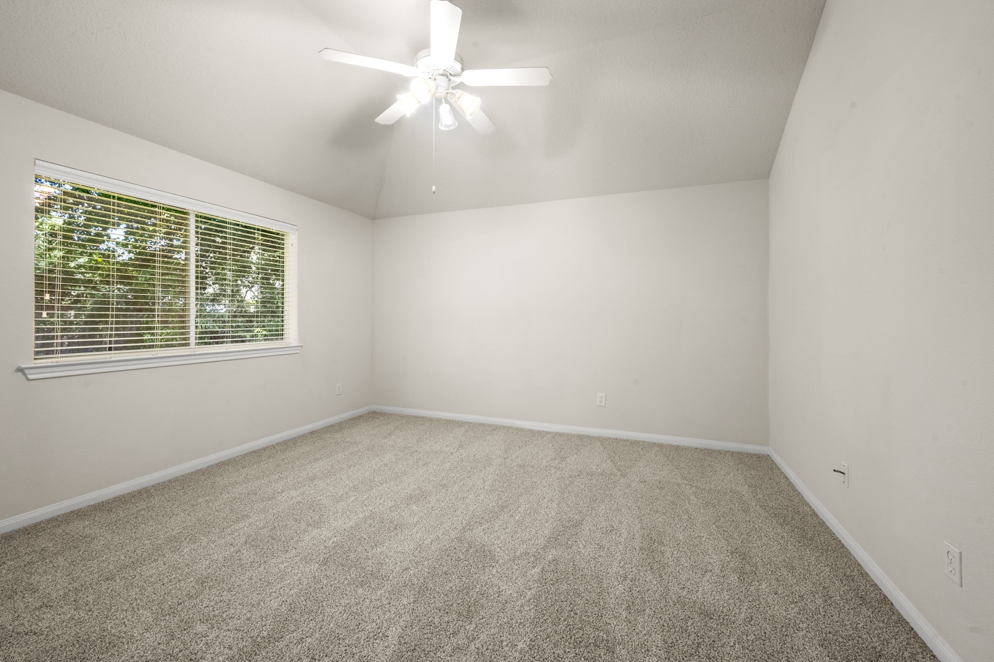 3226 Woodwind Road Montgomery, TX 77356 - Photo 23 of 34 an empty room with a window