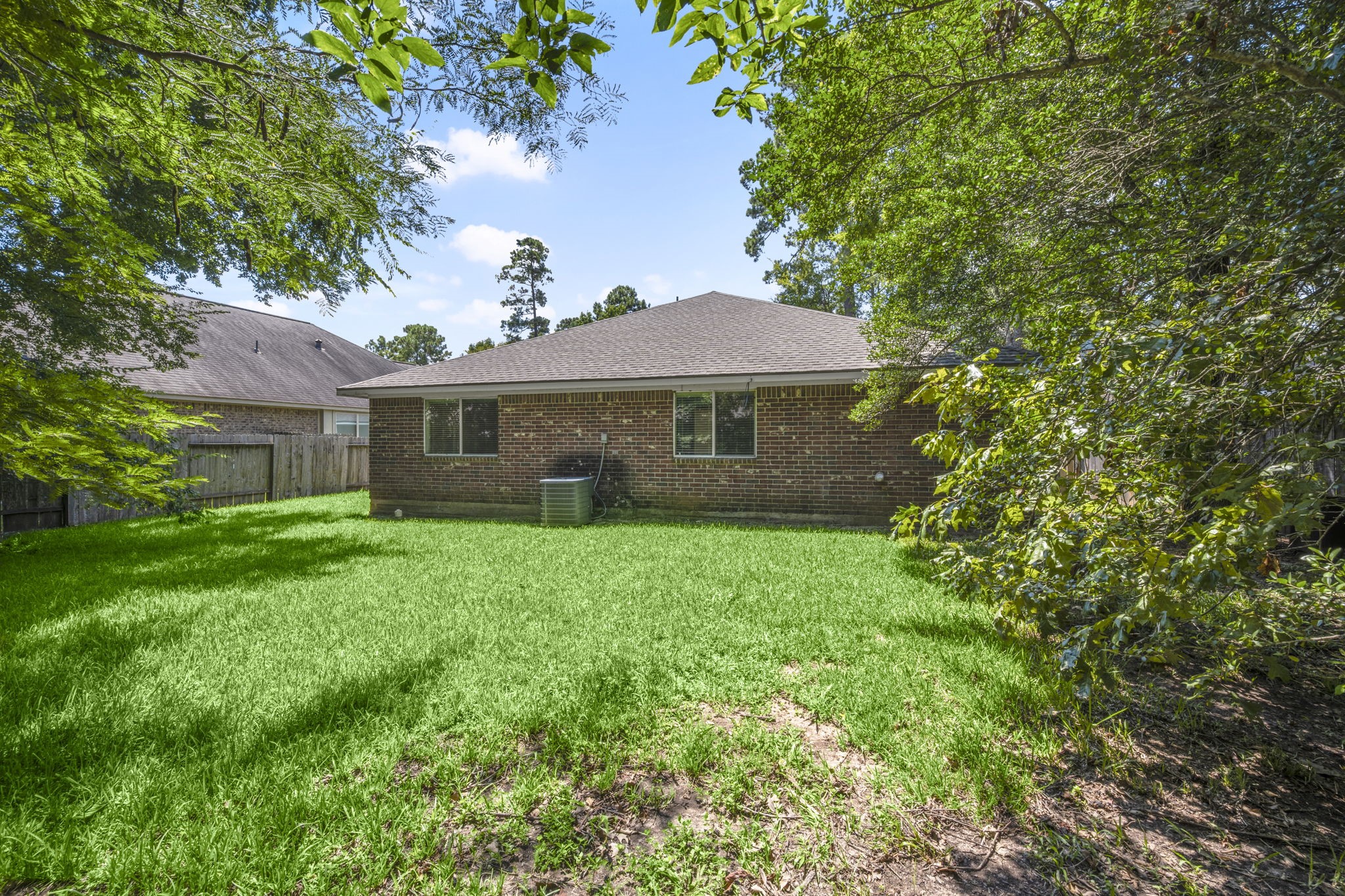 3226 Woodwind Road Montgomery, TX 77356 - Photo 29 of 34 a view of a house with a yard