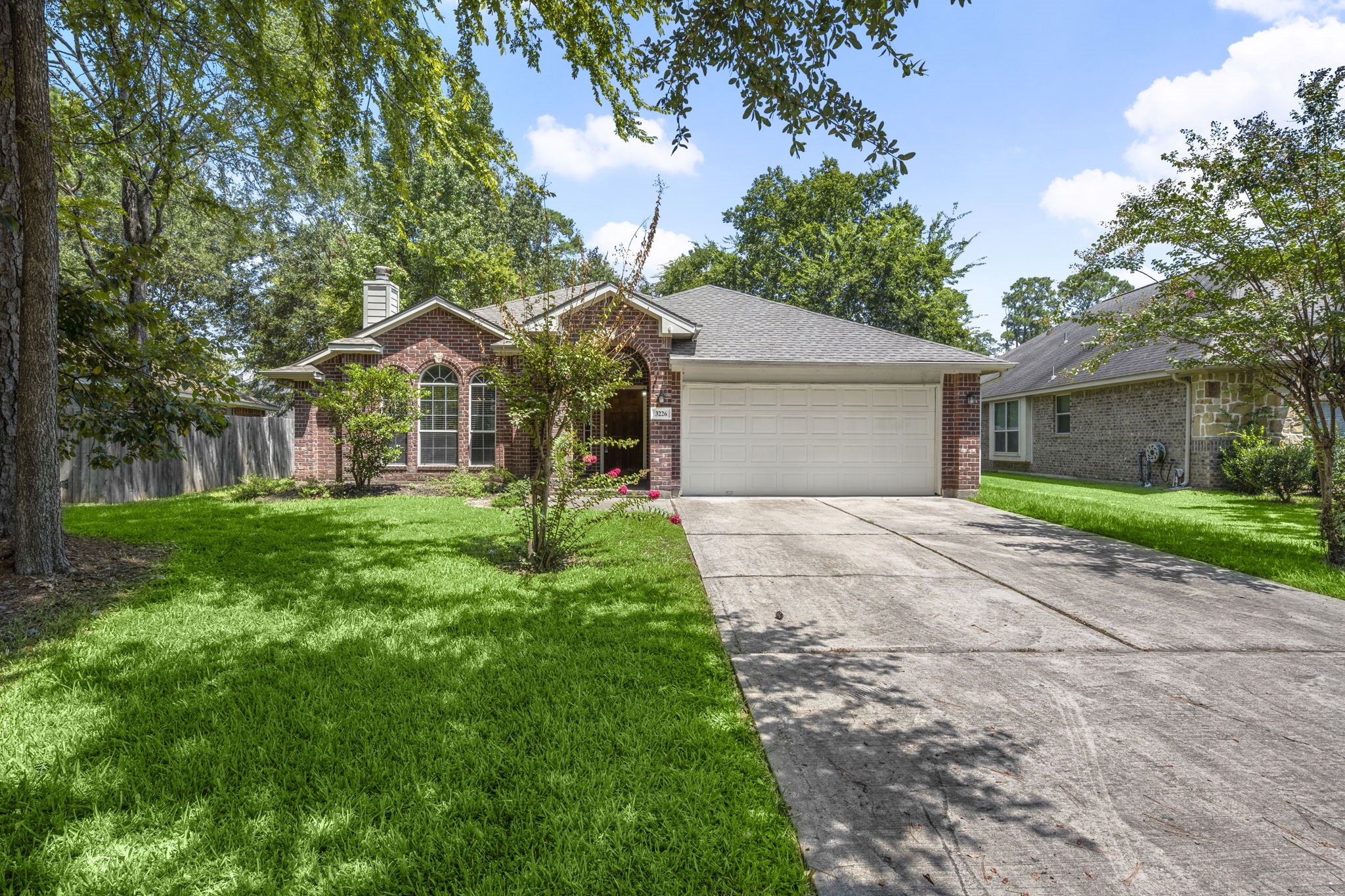 3226 Woodwind Road Montgomery, TX 77356 - Photo 32 of 34 a front view of a house with yard and green space