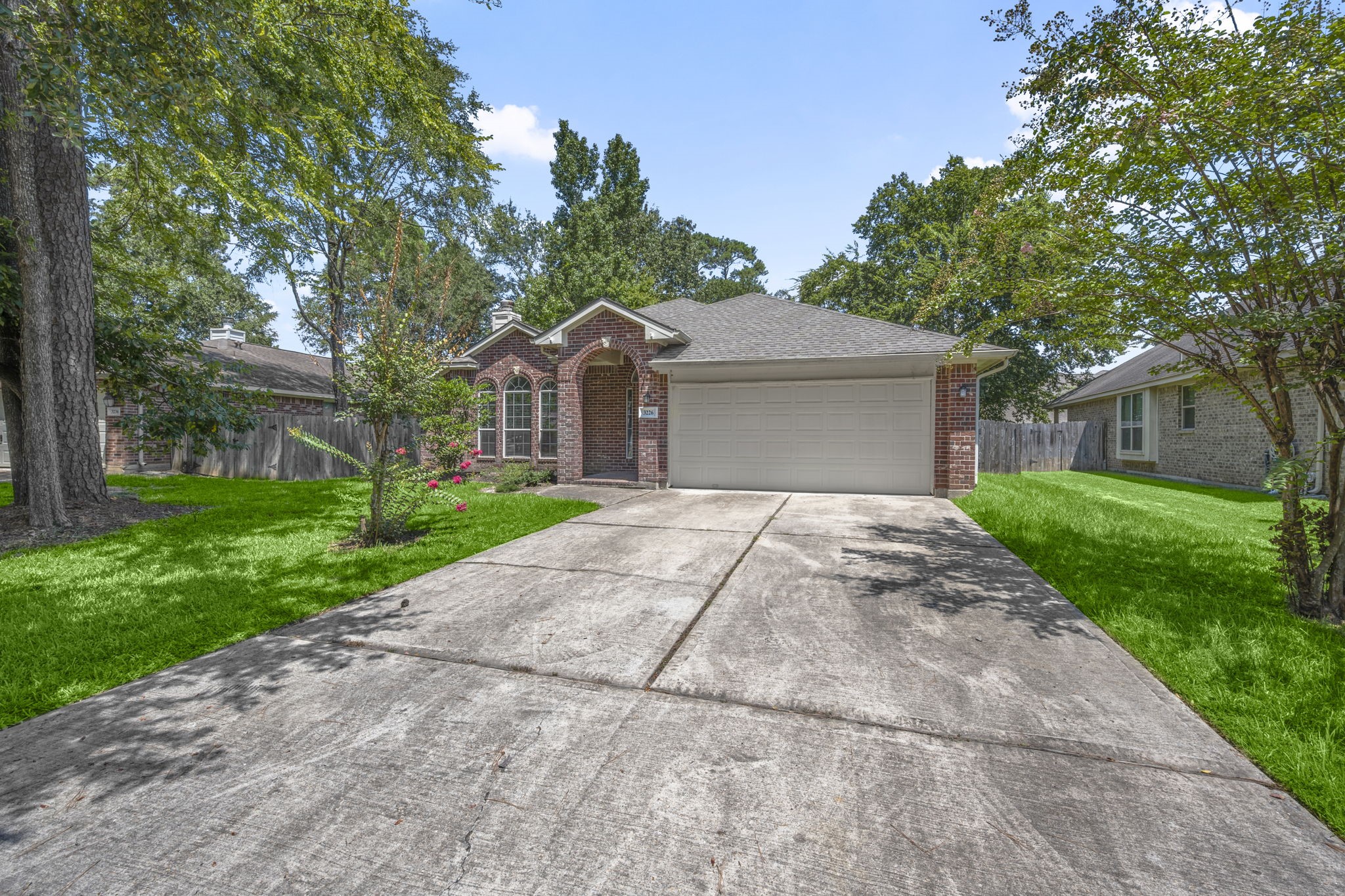 3226 Woodwind Road Montgomery, TX 77356 - Photo 33 of 34 a front view of house with yard and green space