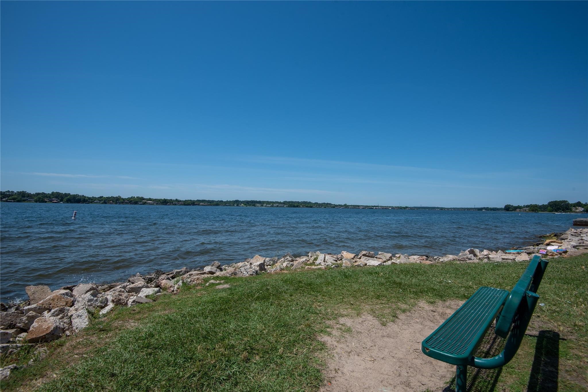 3226 Woodwind Road Montgomery, TX 77356 - Photo 34 of 34 a view of a lake from a yard