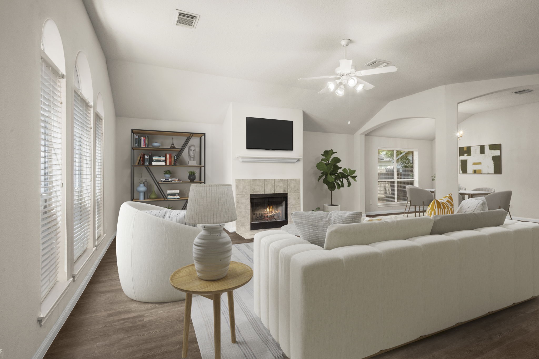 3226 Woodwind Road Montgomery, TX 77356 - Photo 5 of 34 a living room with furniture a fireplace and a flat screen tv