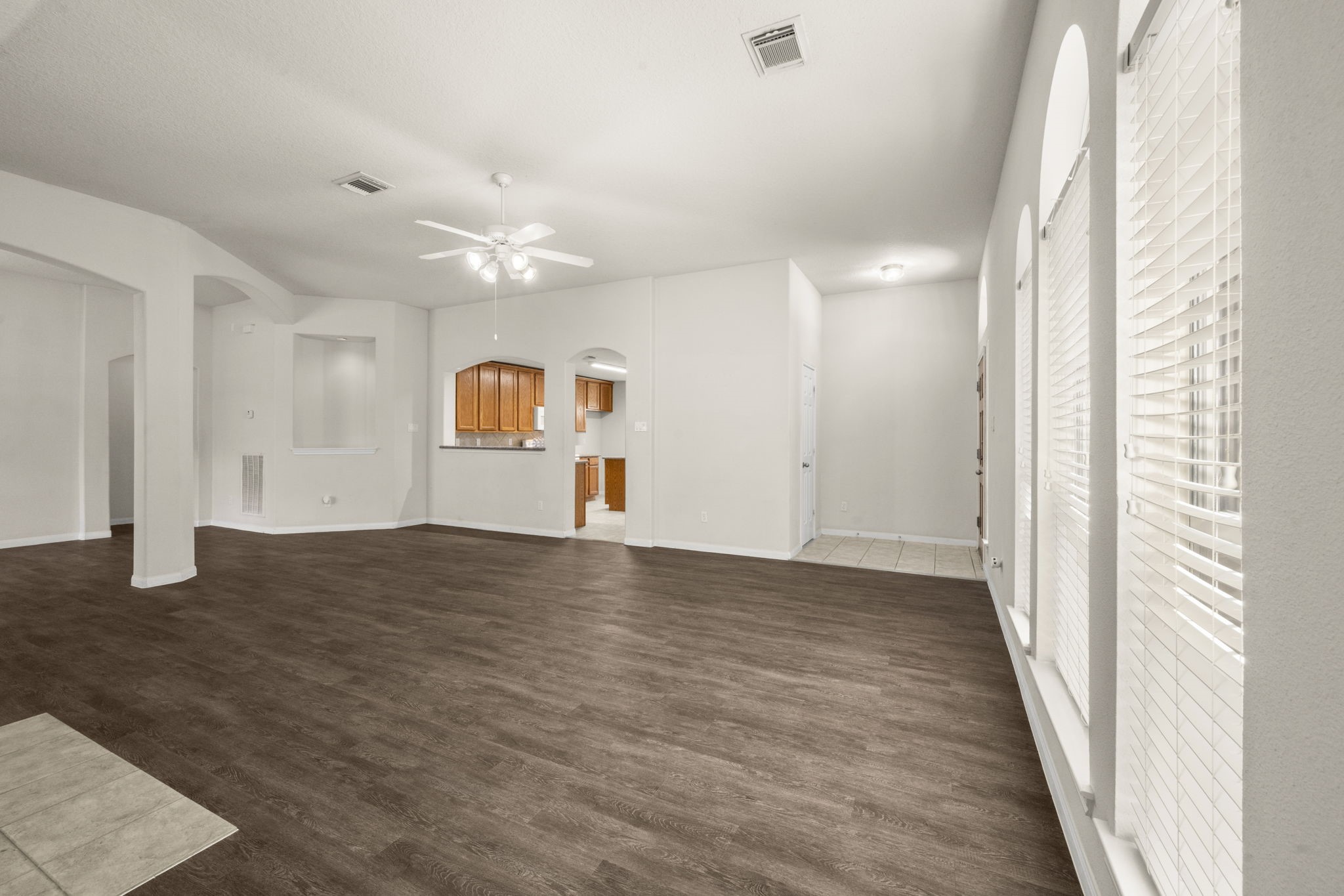 3226 Woodwind Road Montgomery, TX 77356 - Photo 8 of 34 a view of empty room with wooden floor and fan