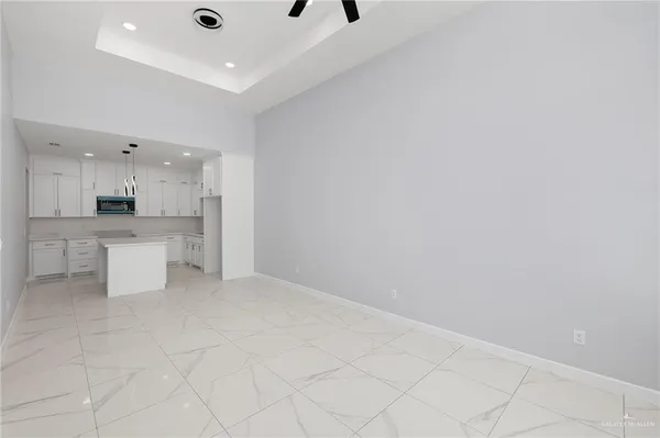 a view of kitchen with white cabinets