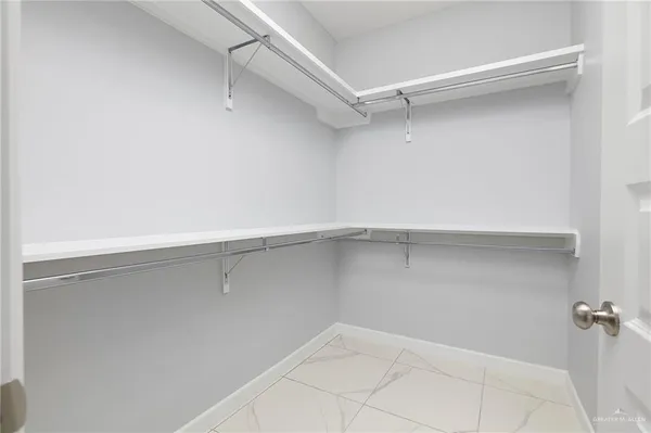 a view of an empty walk in closet