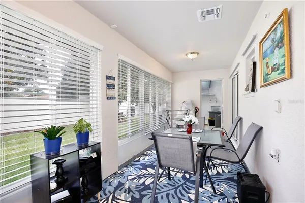 a dining room with furniture and wooden floor