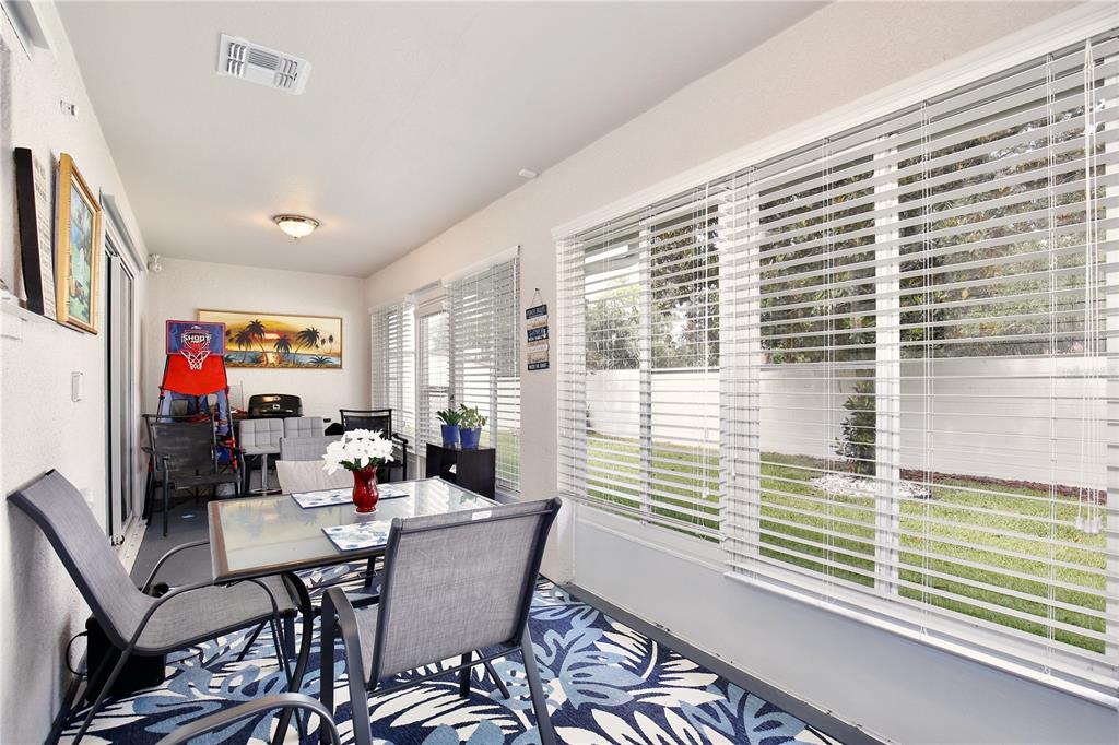 3415 Celena Circle St. Cloud, FL 34769 - Photo 17 of 20 a view of a dining room with furniture and a window