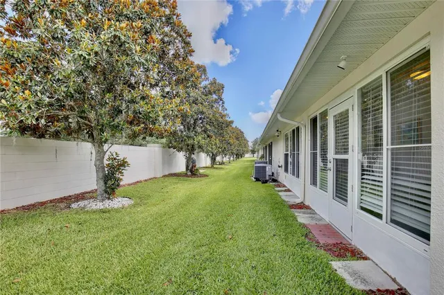 a backyard of a house with lots of green space