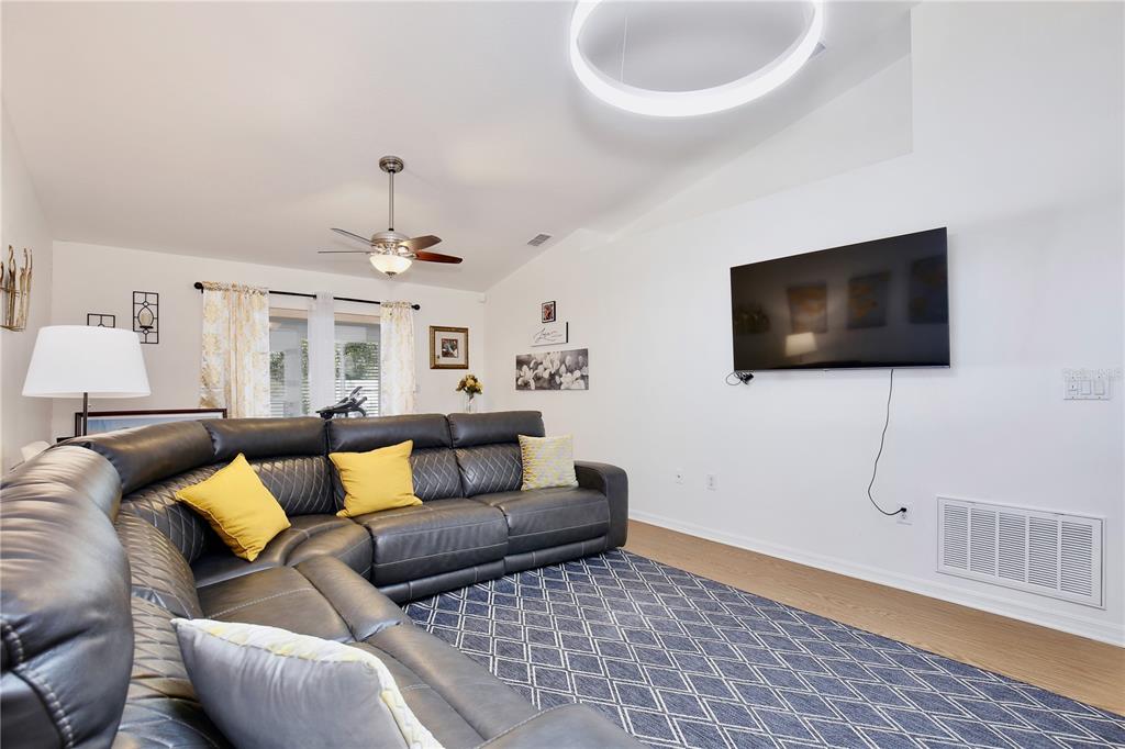 3415 Celena Circle St. Cloud, FL 34769 - Photo 4 of 20 a living room with furniture and a flat screen tv
