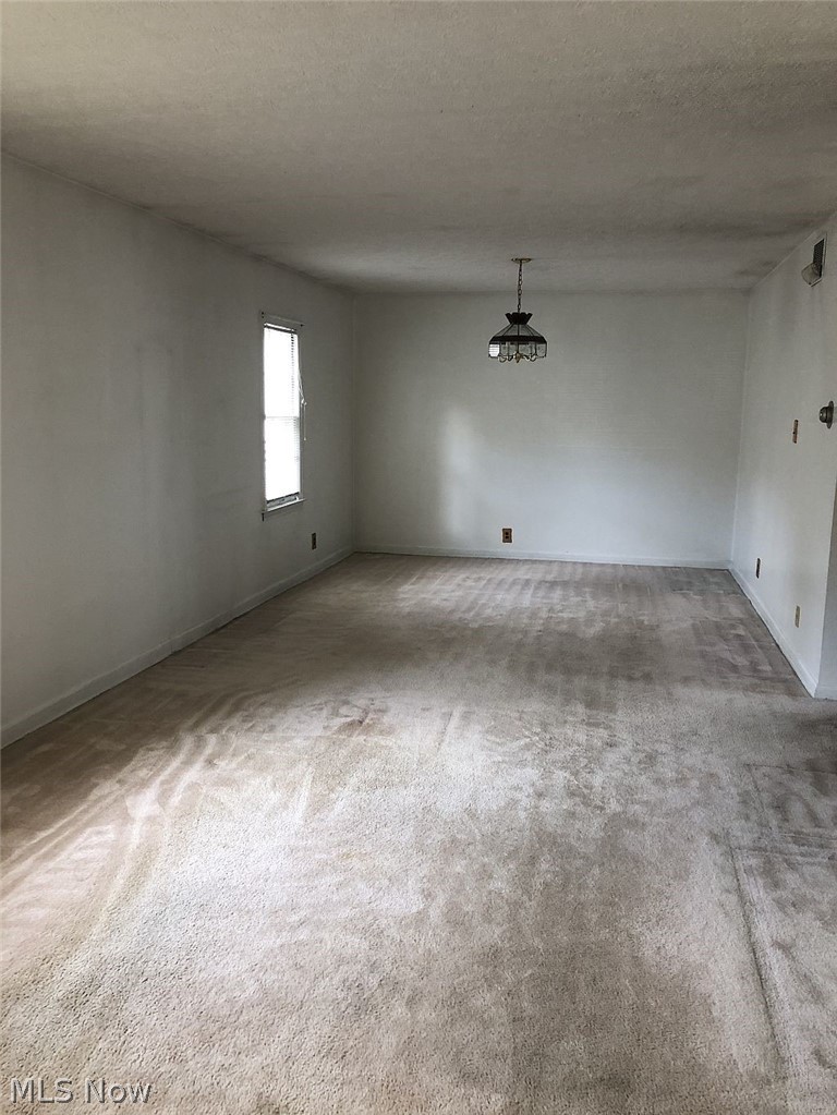 821 Reed Avenue Akron, OH 44306 - Photo 5 of 21 Large great room concept with room for dining and living space. Bedroom 4 wall was removed to enlarge this area.