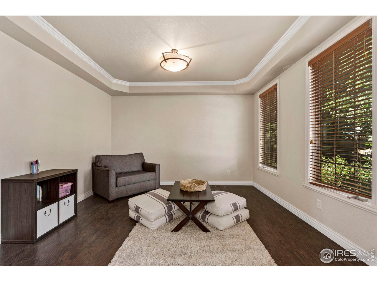 7702 Plateau Road Greeley, CO 80634 - Photo 11 of 40 Secondary Living Room Space Overlooking Front of Home