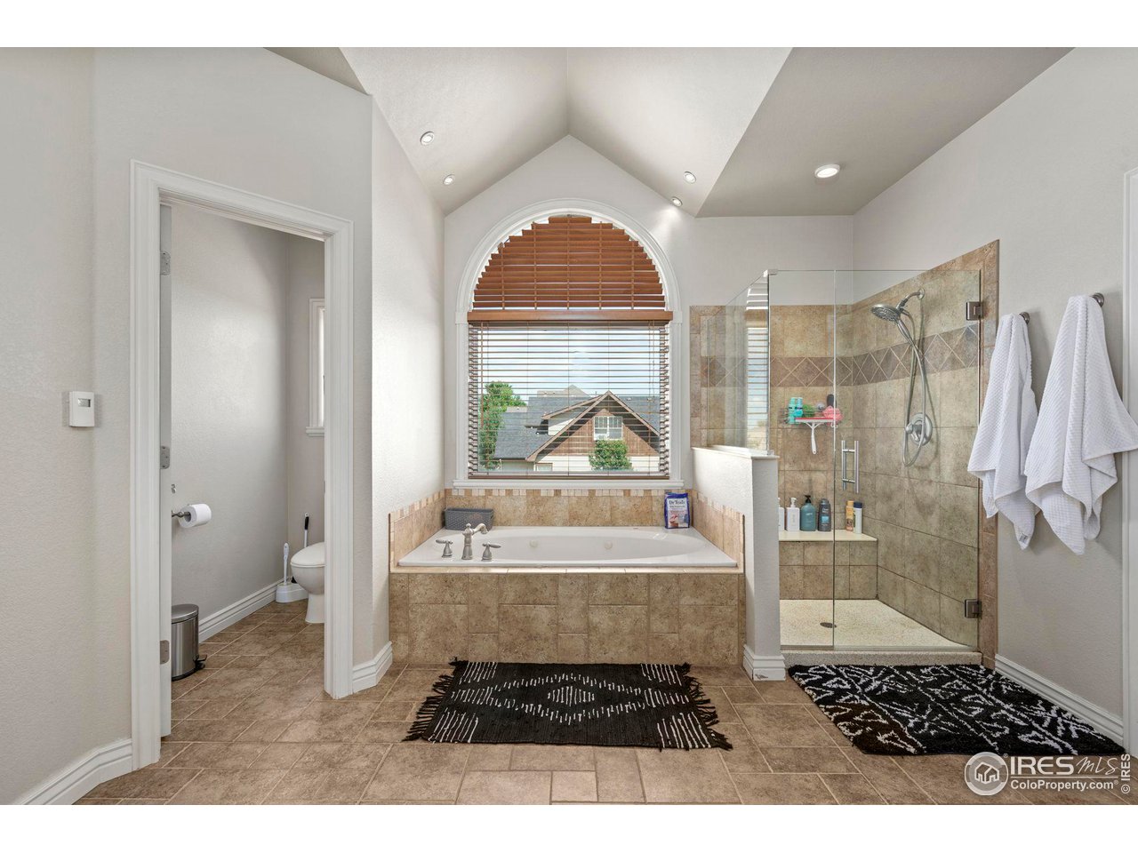 7702 Plateau Road Greeley, CO 80634 - Photo 18 of 40 Jetted Tub , Large Tiled Shower & Heated Tile Flooring!
