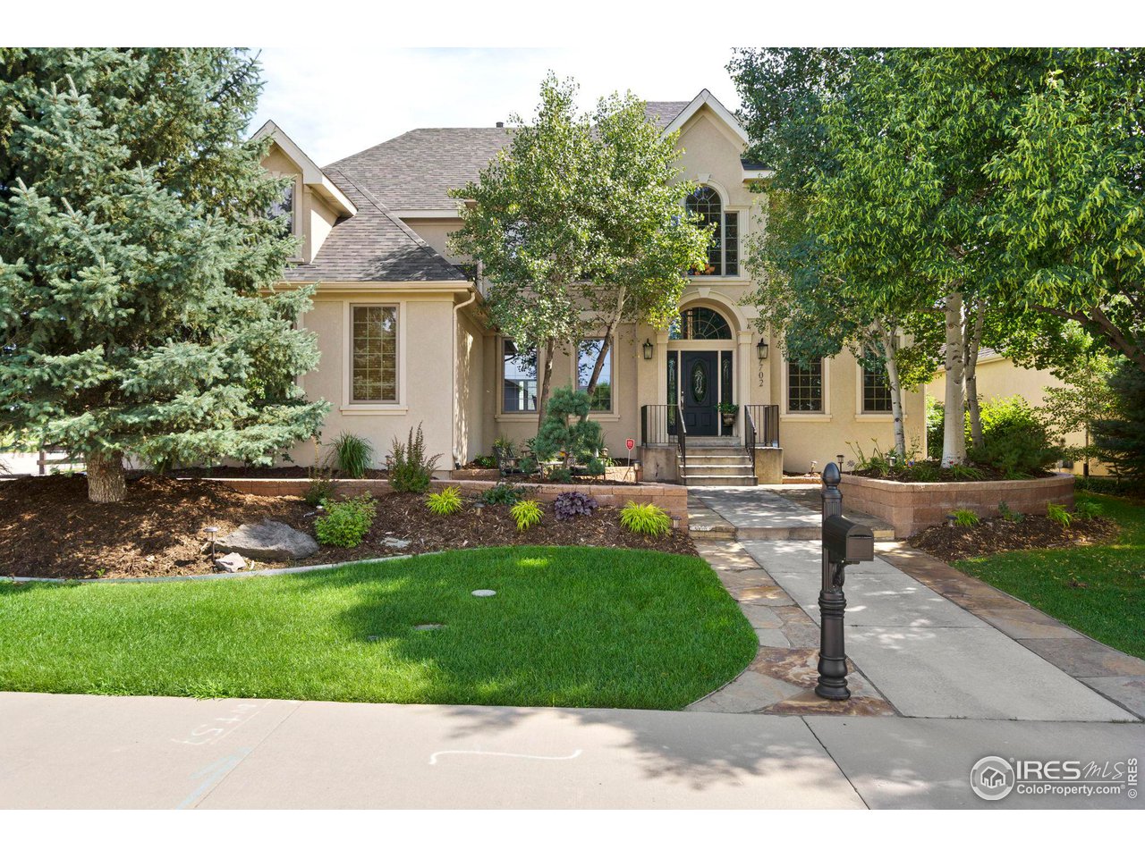 7702 Plateau Road Greeley, CO 80634 - Photo 2 of 40 All Stucco Custom Home on Corner Lot!