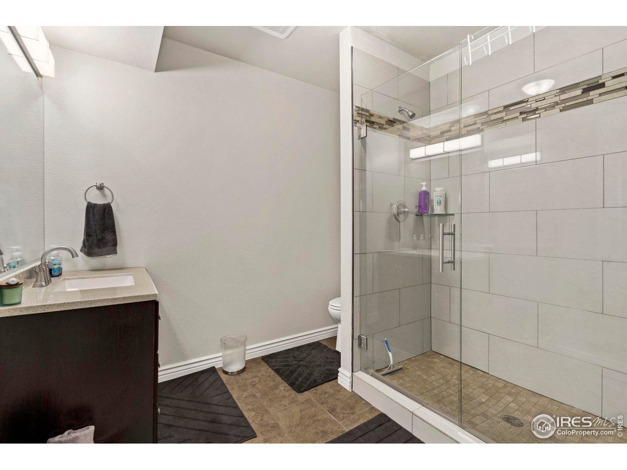 7702 Plateau Road Greeley, CO 80634 - Photo 30 of 40 3/4 Basement Bathroom with Tiled Shower
