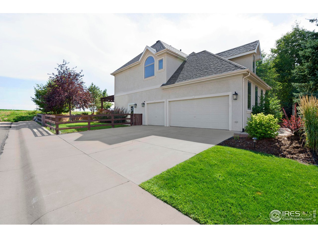 7702 Plateau Road Greeley, CO 80634 - Photo 39 of 40 Oversized 3 Car Garage with Epoxy Flooring, Service Door, Workshop Space & Sits on a Corner Lot!