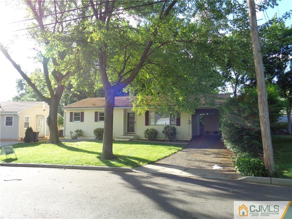 14 Bucknell Road Old Bridge, NJ 08859 - Photo 1 of 15 a front view of a house with a yard and trees
