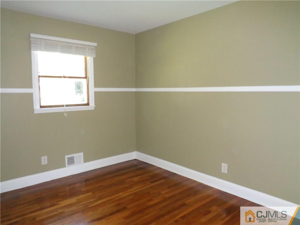 14 Bucknell Road Old Bridge, NJ 08859 - Photo 11 of 15 a view of a room with wooden floor and small window