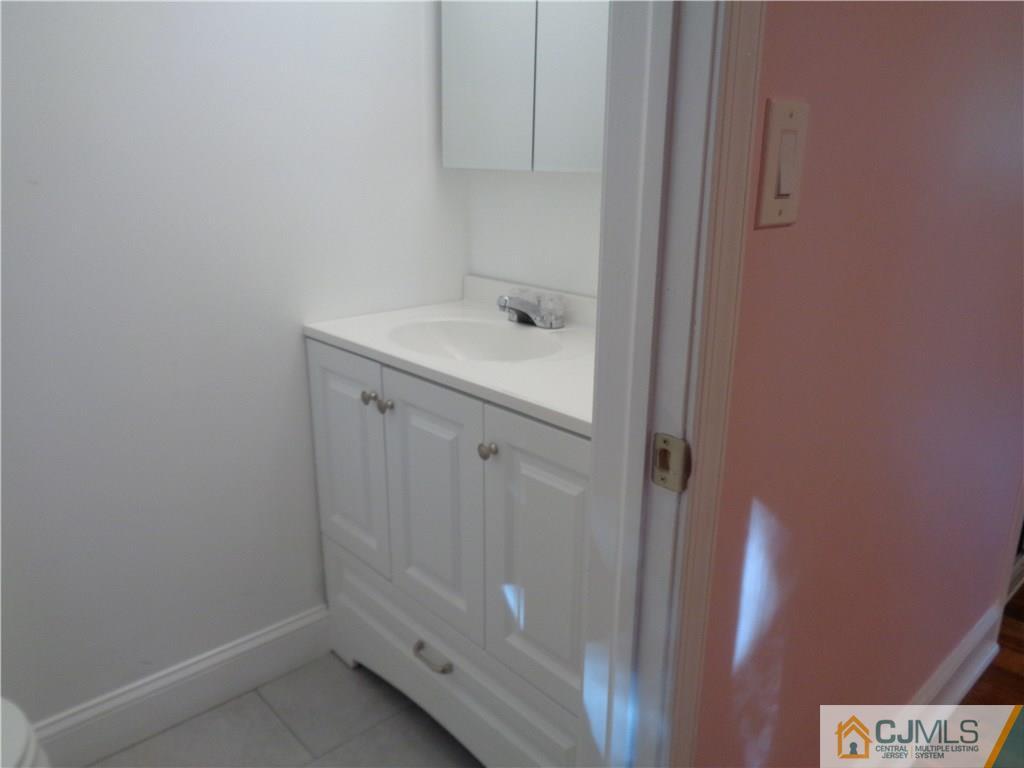 14 Bucknell Road Old Bridge, NJ 08859 - Photo 13 of 15 a bathroom with a sink and mirror