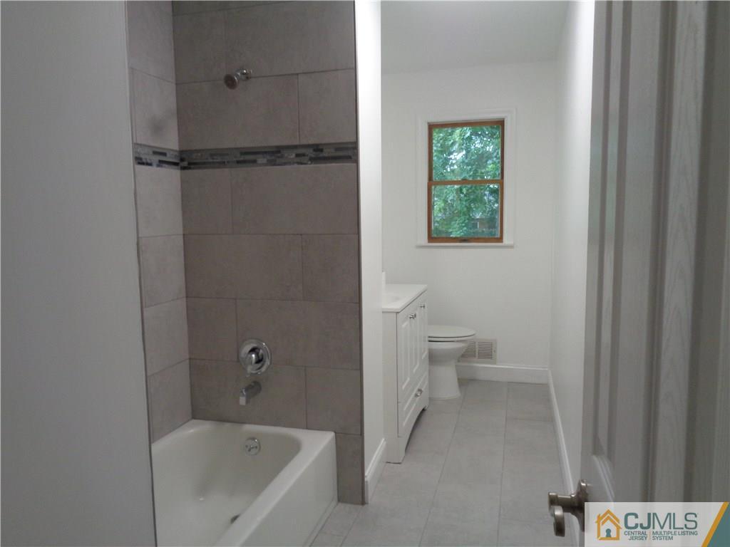 14 Bucknell Road Old Bridge, NJ 08859 - Photo 8 of 15 a bathroom with a bathtub and a toilet